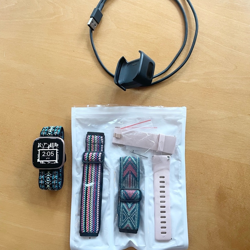 Fitbit Versa. Used once. Rose gold with original pink band